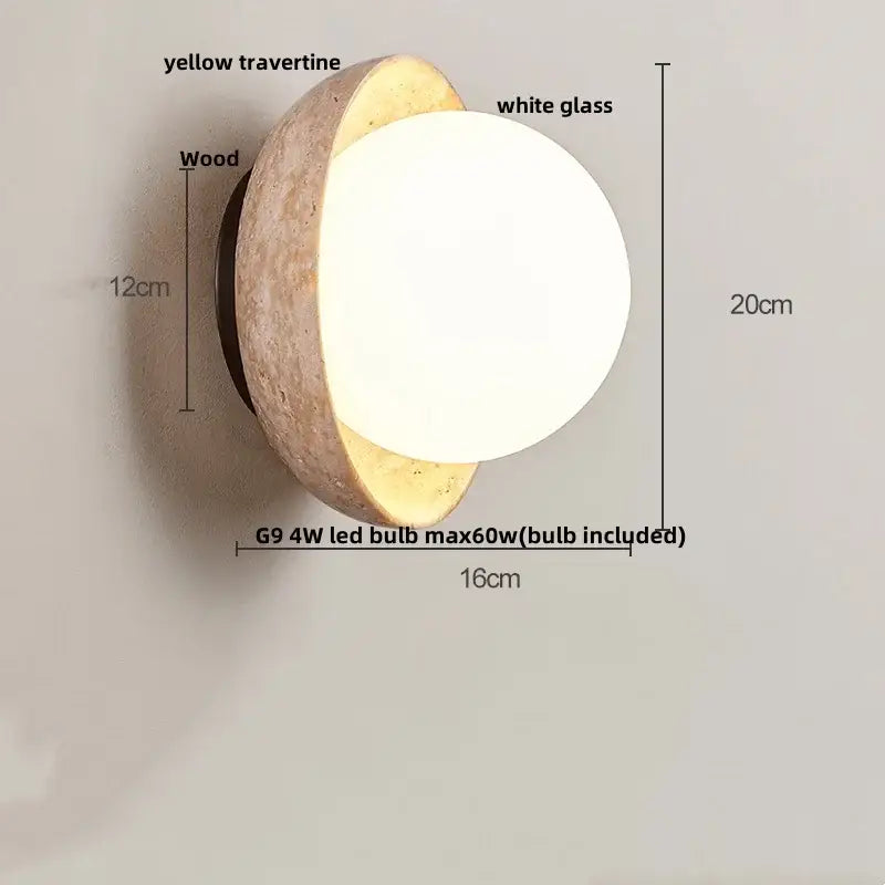 Modern yellow travertine wall sconce with textured yellow travertine half-shell, white glass globe, and wood base decorbites yellow travertine