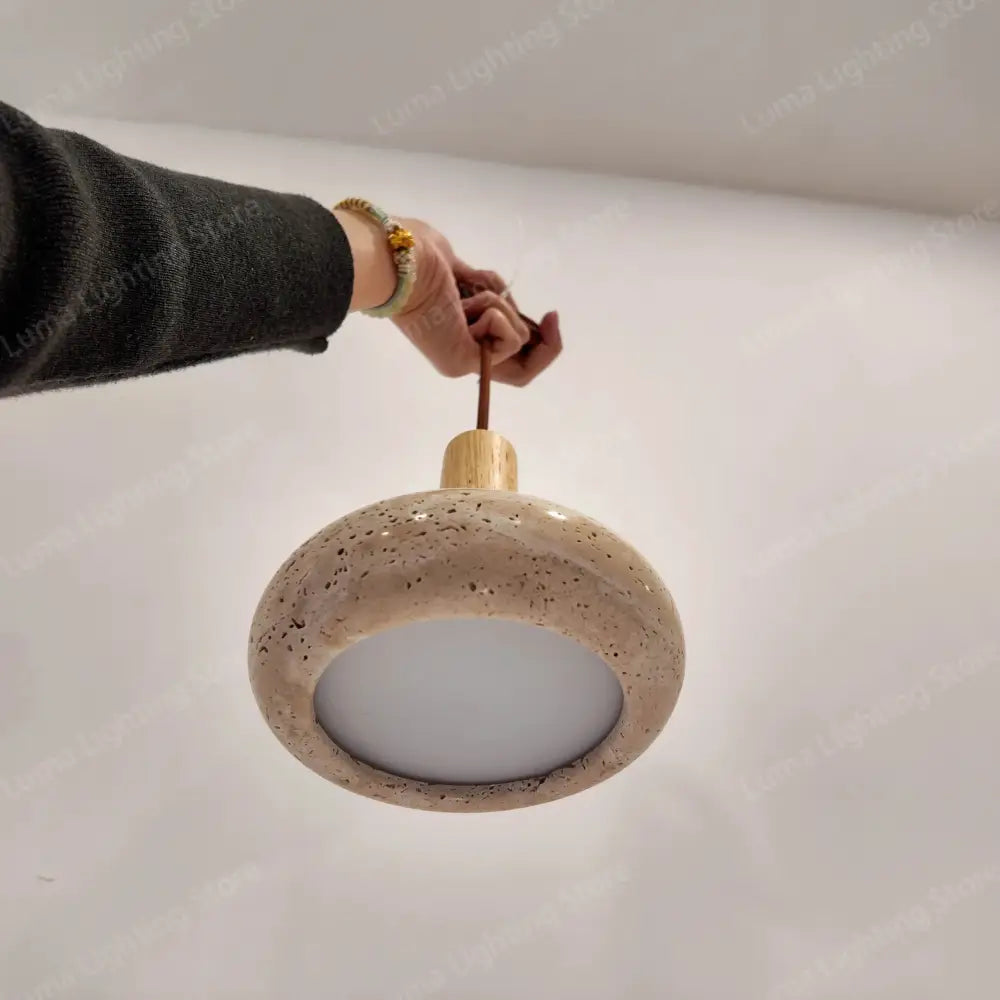 Beige speckled ceramic pendant light with wooden top and fabric cord stone pendant for kitchen island by decorbites