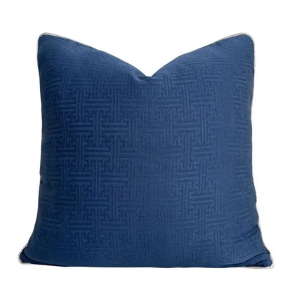 Deep blue cushion cover with subtle woven geometric jacquard pattern and light gray piping for living room decorbites decor