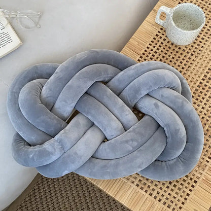 A light blue velvet handmade knot throw pillow with soft textured surface for living room decorbites blue handmade decor