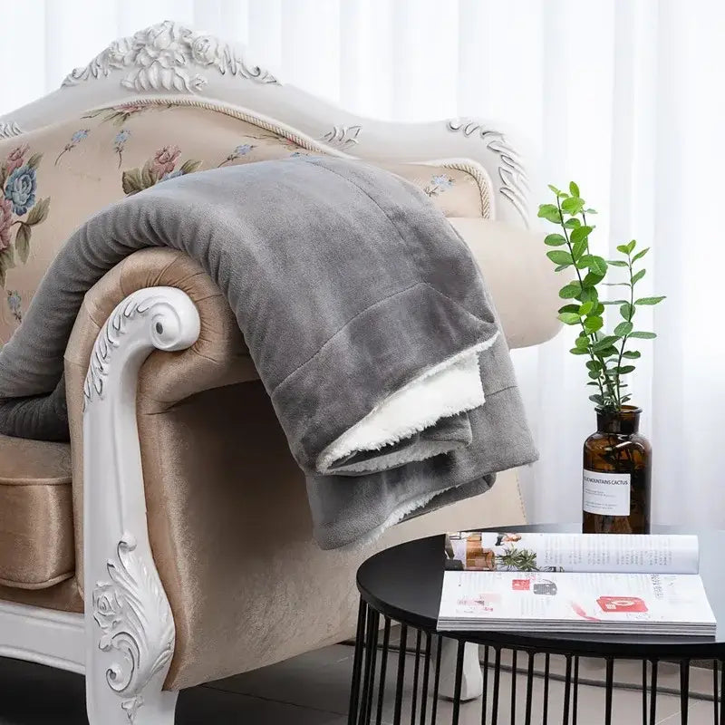 Gray double-layer lamb fleece blanket with soft fleece exterior and white sherpa lining for bedroom throw