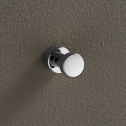 Chrome-finished brass wall mount robe hook with sleek rounded head and circular base for decorbites brass wall use