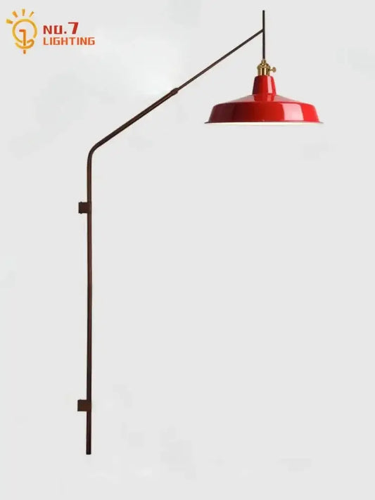Designer red enamel wall lamp with brass gold black swing arm and curved metal fixture for bedroom reading light decorbites gold black
