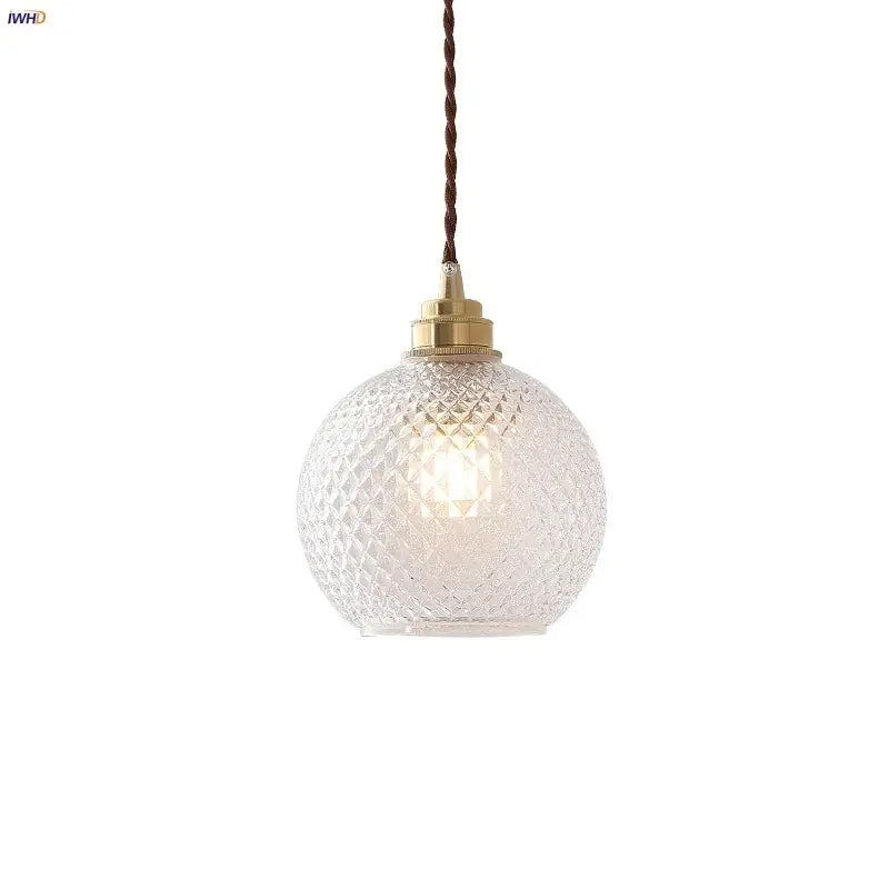Clear glass globe led pendant light with diamond-cut pattern brass hardware and twisted brown cord for kitchen decorbites pendant light