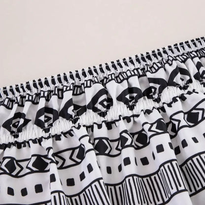 White and black geometric-patterned elastic-waist shorts featuring a diamond lattice ruffled design for stylish comfort