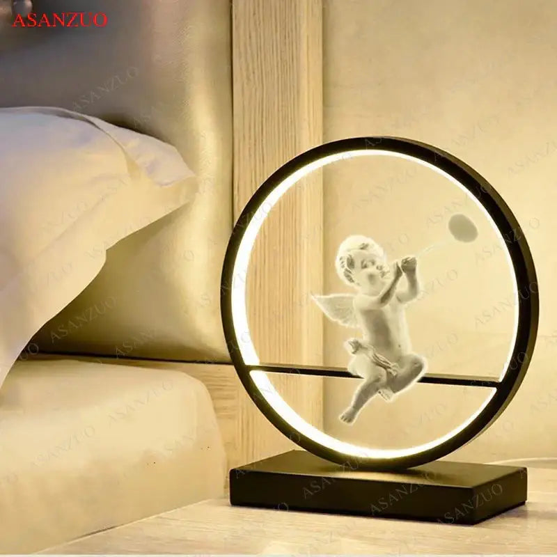 A sleek black dimmable angel table lamp with a white translucent cherub in glowing ring for bedroom decor