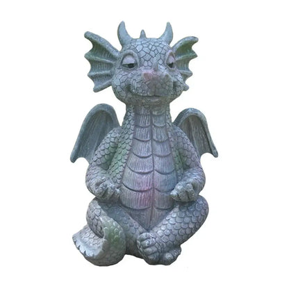 A gray-green resin dino garden sculpture with detailed scales and a friendly expression for outdoor decorbites dino garden decor