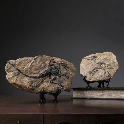 Two fossilized dinosaur skeletons in stone slabs displayed on black stands dinosaur fossil resin craft decorbites desk decor