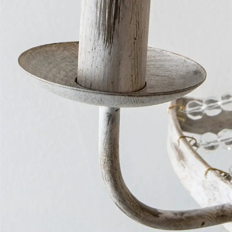 Distressed white metal wall lamp with curved arm and decorbites crystal tassel beads for bedroom decor