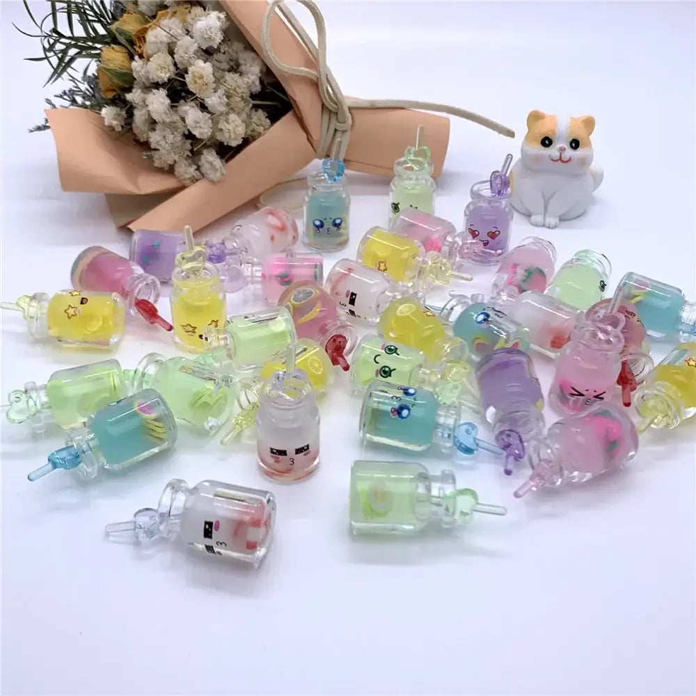 A collection of colorful translucent resin diy heart pearl shell miniature wishing bottles with cartoon faces decorbites heart pearl decor