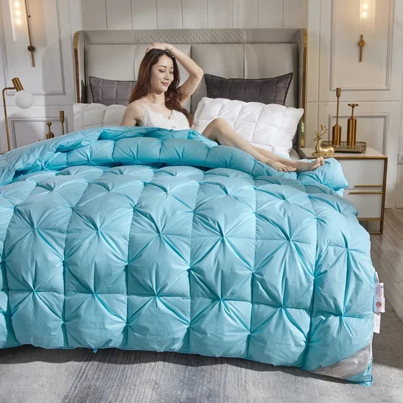 Light blue quilted down duvet with diamond stitch pattern filled with 95 white goose down for warm comfort