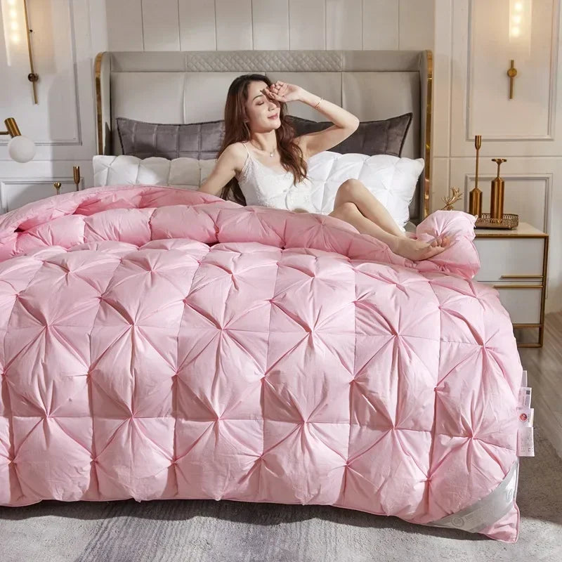 Pink quilted down duvet with diamond-stitched pattern filled with 95 white goose down for five-star hotel warmth