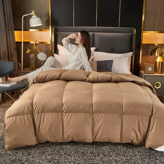 A plush tan down duvet with stitched square panels filled with 95 white goose down for five-star hotel warmth
