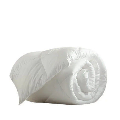 A plush white quilted down duvet rolled neatly made with 95 white goose down for warm five-star hotel use