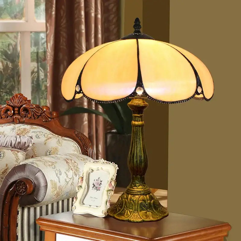 Yellow stained glass decorbites dragonfly tiffany stained table lamp with black metal accents and ornate brass base