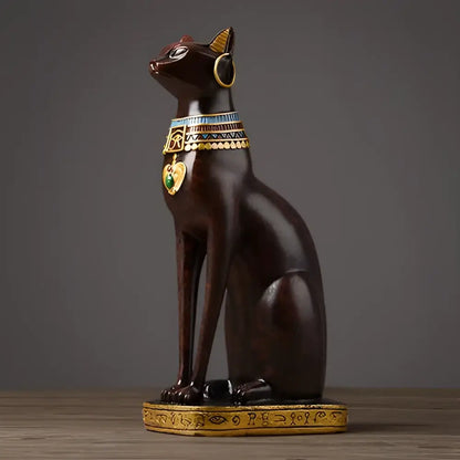 Dark brown egyptian cat resin figurine with gold and green accents and hieroglyphic base for home decor