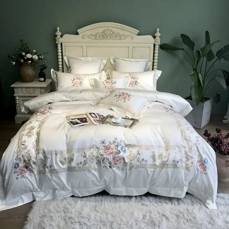 Elegant white satin-like egyptian cotton white embroidery bedding set with soft pink blue and gold floral accents