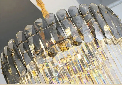 Elegant amber and clear crystal led pendant chandelier with gold-toned metal and cascading prisms for dining room decorbites crystal led