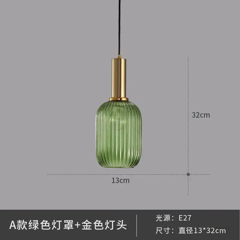 Green ribbed glass pendant light with gold-toned metal fixture perfect for elegant dining room glass pendant lights