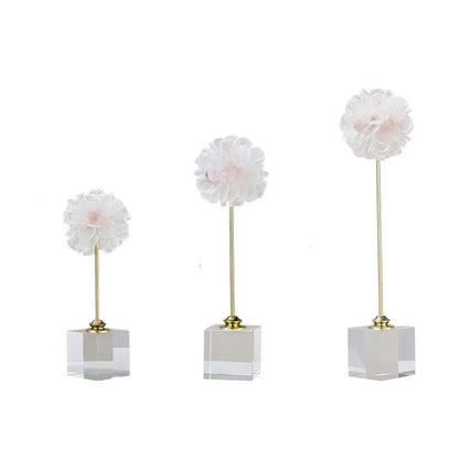 Elegant amethyst crystal flower glass sculptures featuring three white fabric crystal flowers with pink centers on gold stems decorbites crystal flower decor