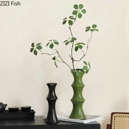 A sleek glossy green bamboo shape ceramic vase with segmented design for elegant living room decorbites bamboo shape decor