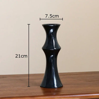 A sleek glossy black bamboo shape ceramic vase with a slender fluted design for living room table decorbites decor