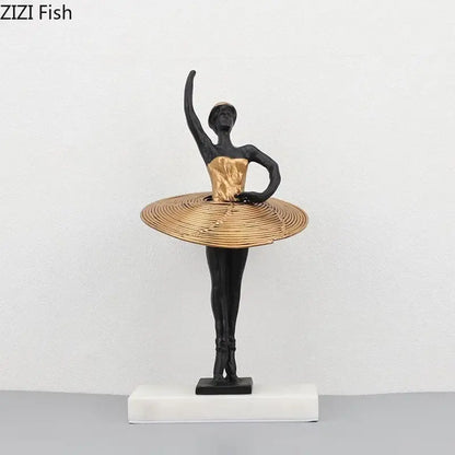 Elegant black and gold ballerina sculpture with woven golden tutu on white marble base for bedroom decor