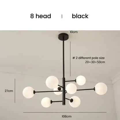 Elegant black gold glass ball chandelier with eight frosted globe lights for modern living room lighting