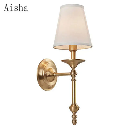Elegant black gold wall lamp with brass finish and tapered off-white fabric shade for bedroom decorbites black gold