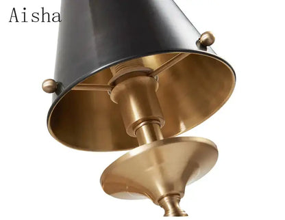 Elegant black and brass decorbites black gold wall lamp with conical shade and spherical finials for bedroom decor