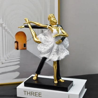 Elegant black and white ballet dance girl double statue featuring a golden and white figurine with intricate dress details on a black base