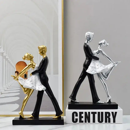 Elegant black and white ballet dance girl double resin statue featuring a golden and black dancing couple for living room decor