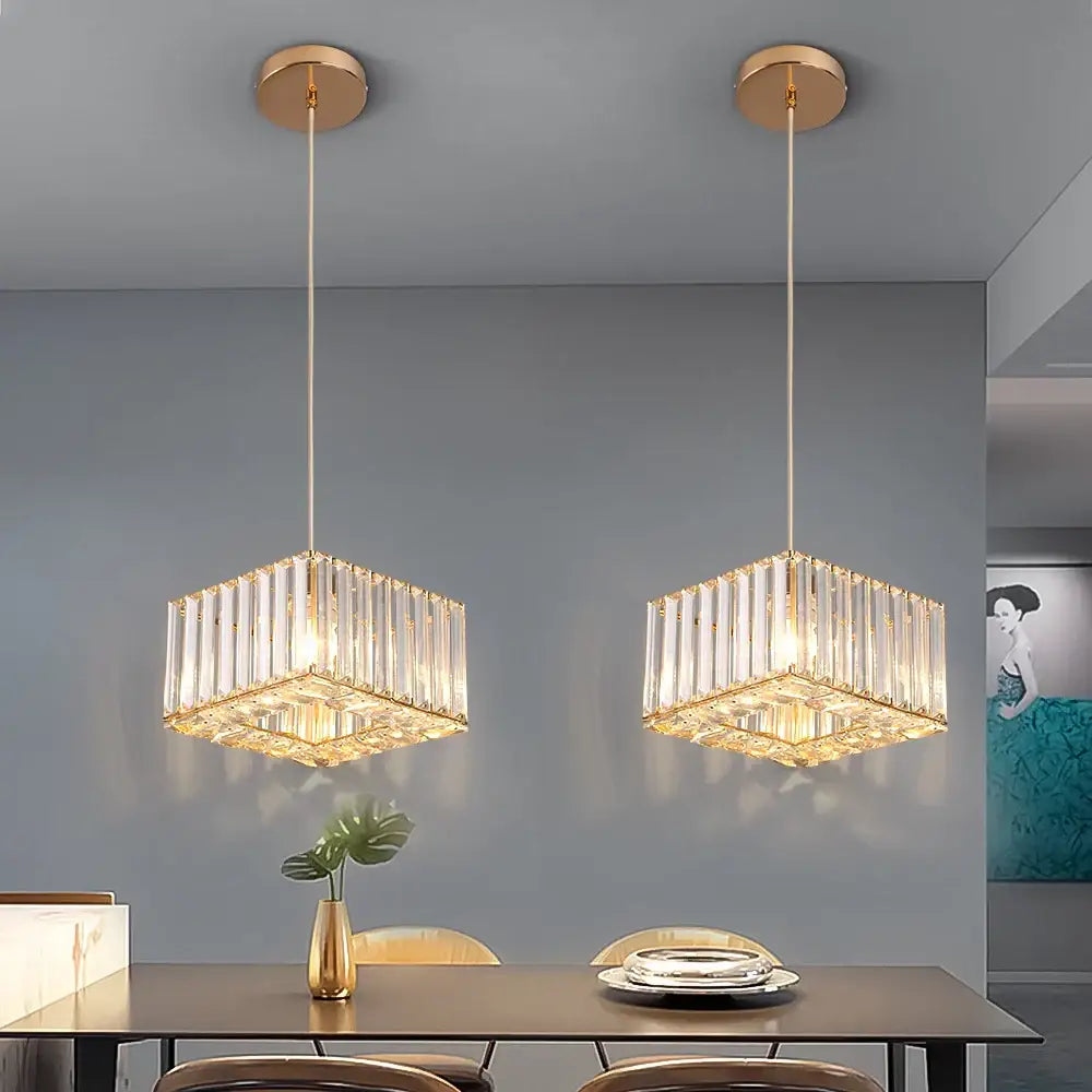 Two elegant gold-toned brass pendant lights with faceted crystal bars for dining room decorbites crystal led pendant