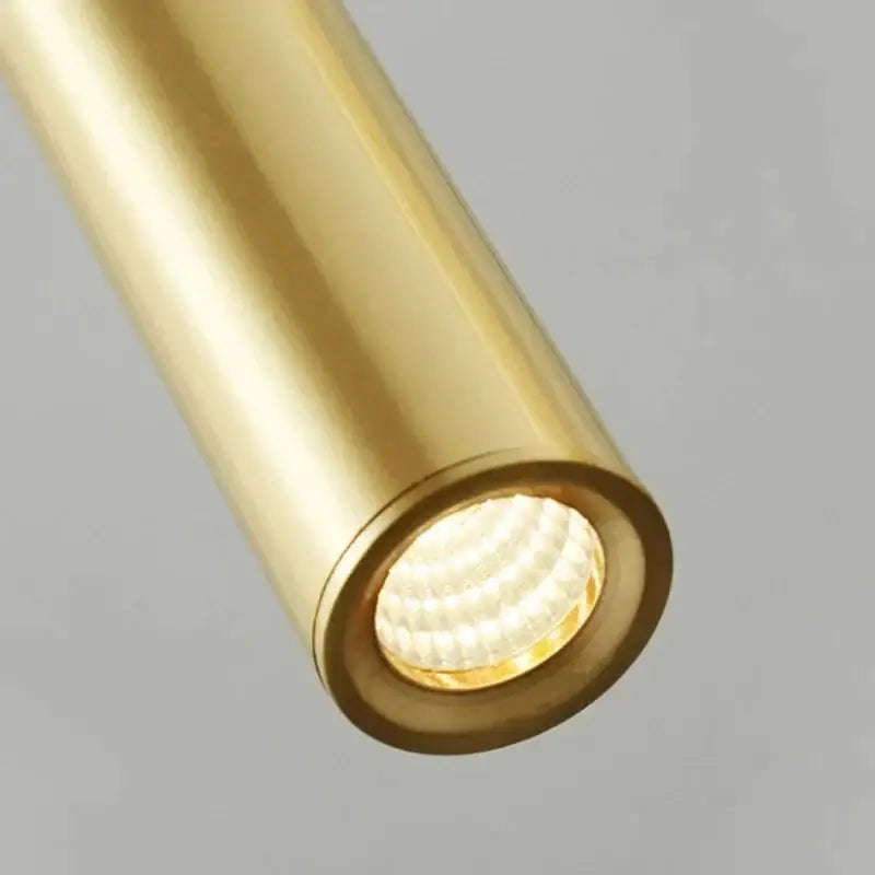 A sleek cylindrical gold-finished led spotlight from decorbites elegant brass pendant light for modern dining room decor