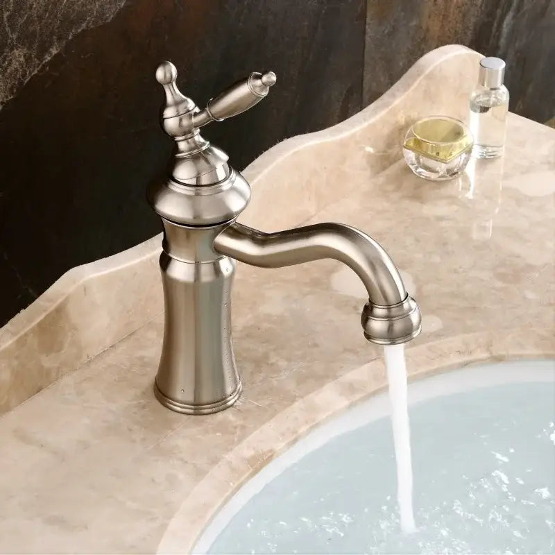 Elegant brushed nickel basin faucet with single-handle curved spout and decorative cross handle by decorbites brushed nickel