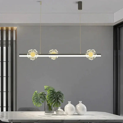 Modern linear pendant light with three illuminated gold and white floral designs decorbites elegant butterfly chandelier