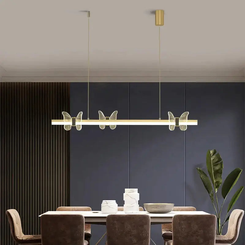 Gold-toned decorbites elegant butterfly linear pendant light with translucent wings for modern dining room decor