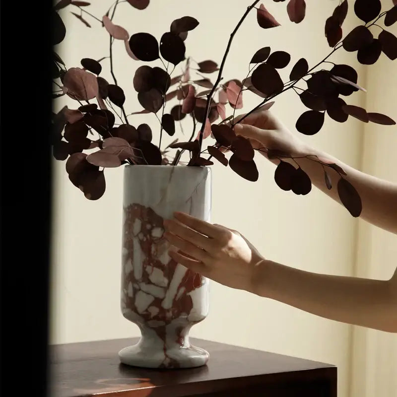 A tall elegant ceramic calacatta red marble vase with a white base for living room decorbites calacatta red decor