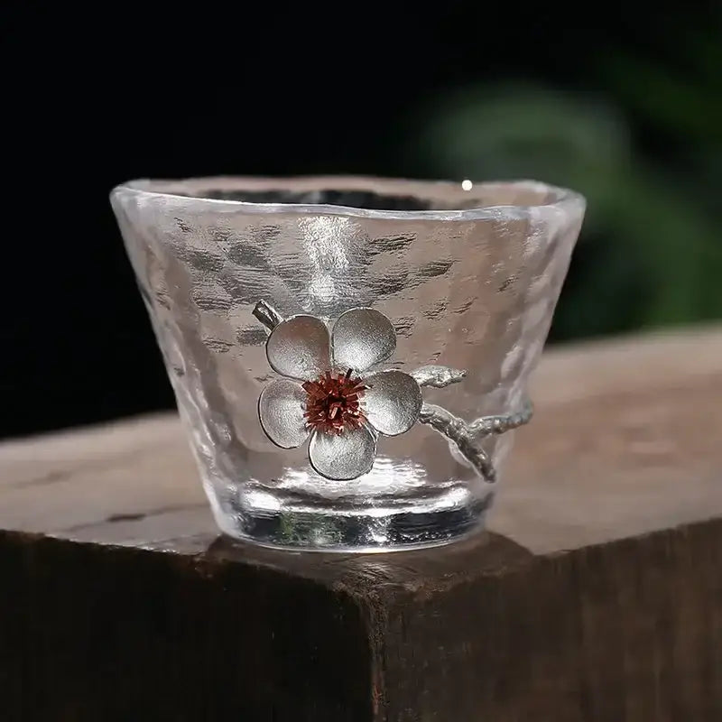 Elegant carved tin glass tea cup set featuring a clear hammered glass tea cup with silver cherry blossom design