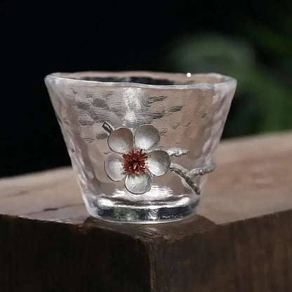 Elegant carved tin glass tea cup set featuring a clear hammered glass tea cup with silver cherry blossom design