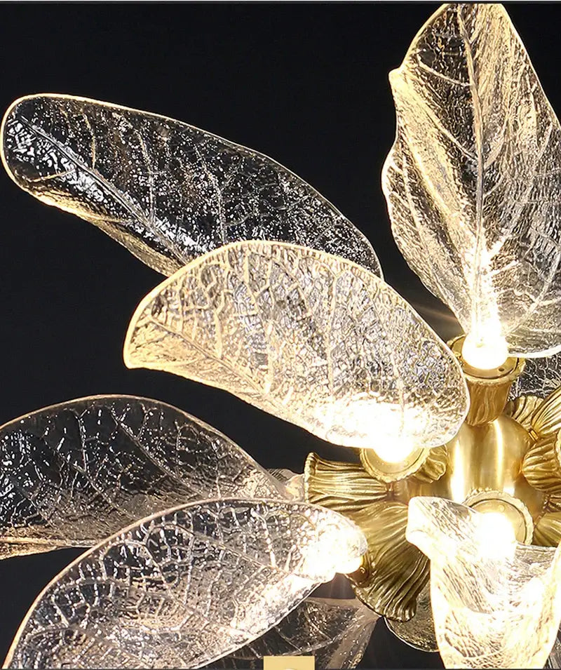 Elegant copper chandelier light with golden leaf-shaped glass petals featuring intricate veining and warm glow decorbites elegant copper
