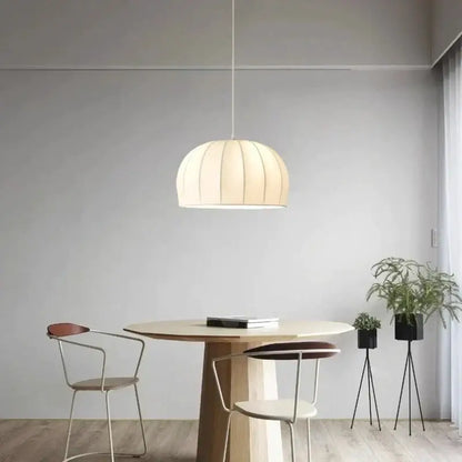Cream-colored pleated decorbites elegant silk pendant light with soft diffused glow for dining room decor