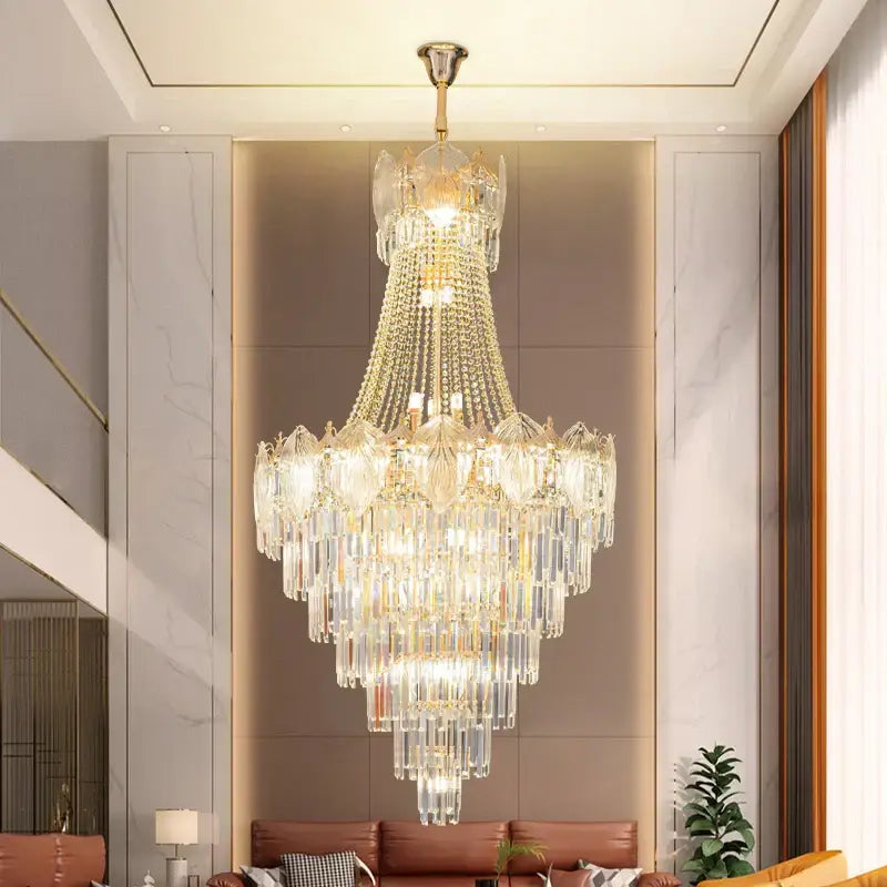 Elegant crystal duplex chandelier with cascading clear glass prisms and gold accents in modern living room decorbites elegant crystal