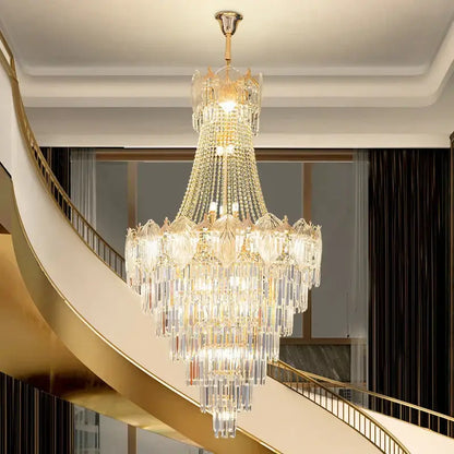 Elegant crystal duplex chandelier featuring cascading clear and gold-toned glass suspended from polished brass fixture