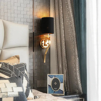 Elegant crystal gold wall lamp with gold-toned curved arm and black fabric shade for bedroom decorbites crystal gold style