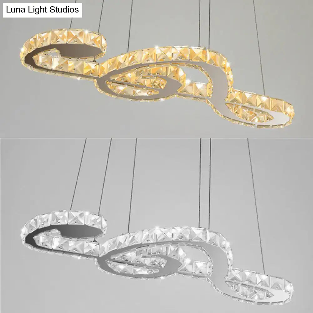 DecorBites™ musical note pendant light featuring a gold-toned clear crystal chandelier with white warm third LED design