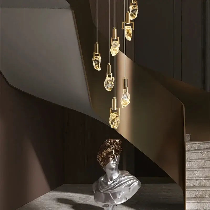 Elegant diamond crystal golden pendant lights with brass fixtures in a modern diamond crystal chandelier arrangement