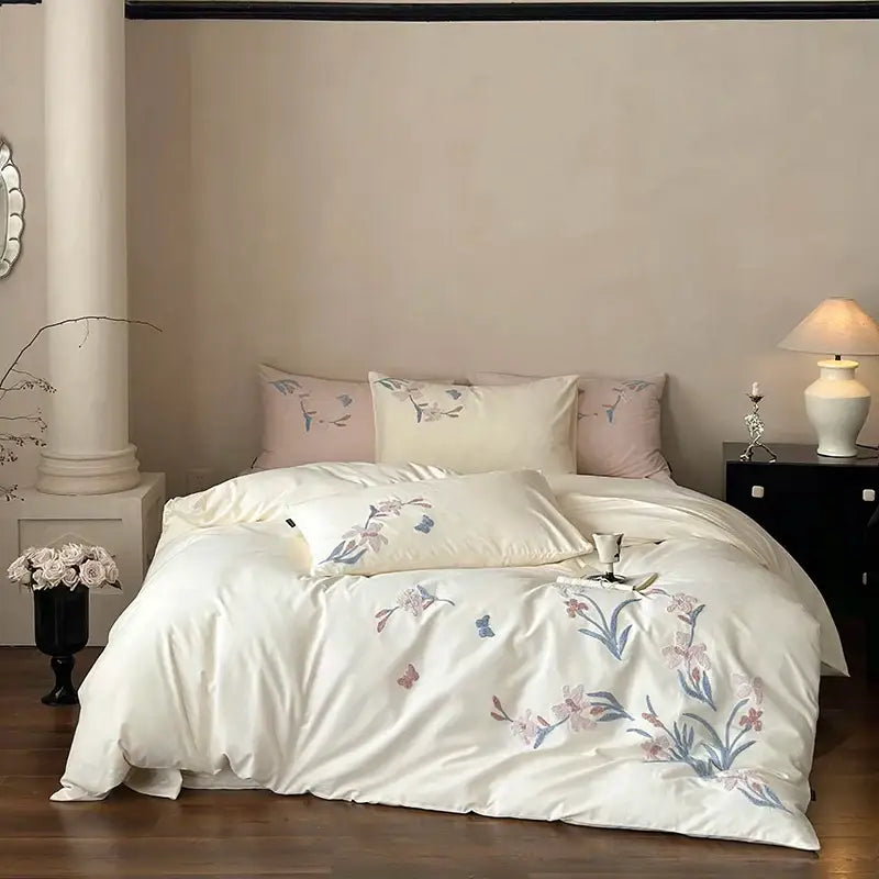 Cream satin bedding set with elegant flower embroidery in pink and blue for decorbites elegant flower bedroom decor