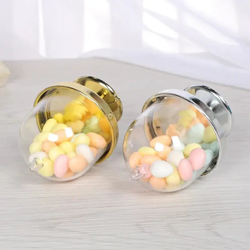 Elegant glass dome candy box tray with two transparent glass decorbites candy boxes filled with pastel marshmallows
