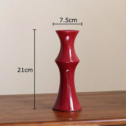 Elegant glossy red bamboo ceramic vase with slender fluted design and tapered base for decorbites bamboo ceramic decor